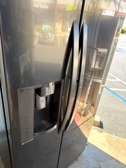 LG black stainless steel refrigerator and door and door window