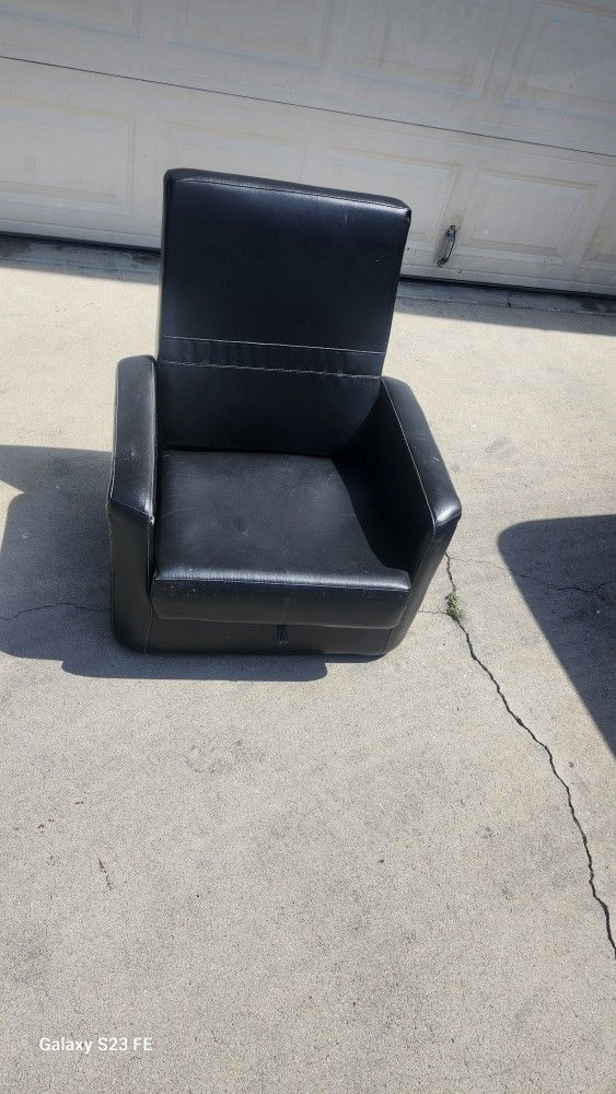 Used small black leather ottoman