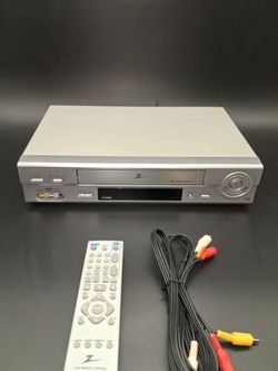 Zenith, VCR with remote and cable. Works fine!