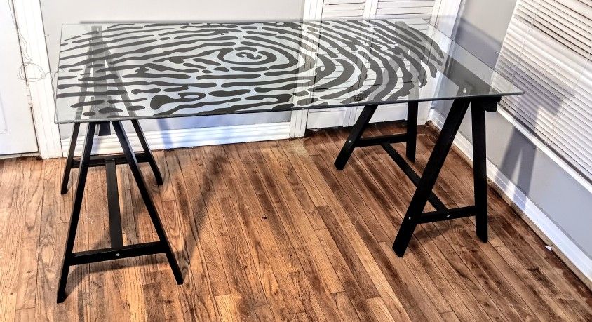 Ikea fingerprint glass desk table. Measurements (58 x 28.5) and 28 inch height. Heavy glass, black wo