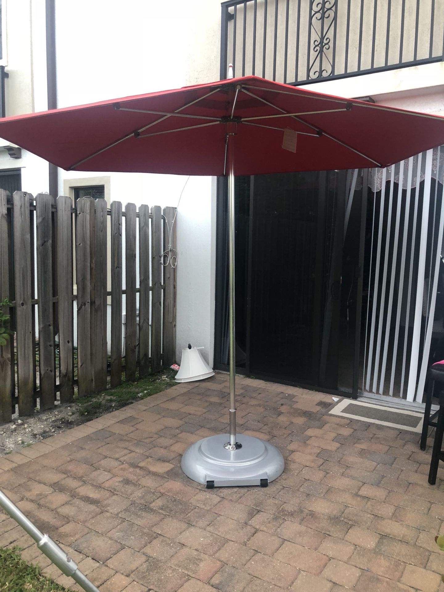 Great condition Tuuci umbrella with Base!! $800.00