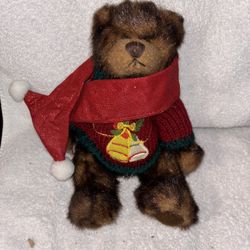 Teddy bear in Christmas sweater and scarf
