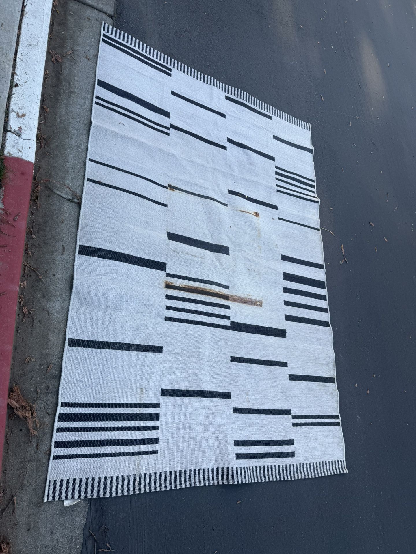 Patio Rug – Good Condition Overall, Has Rust Stains (See Photos)