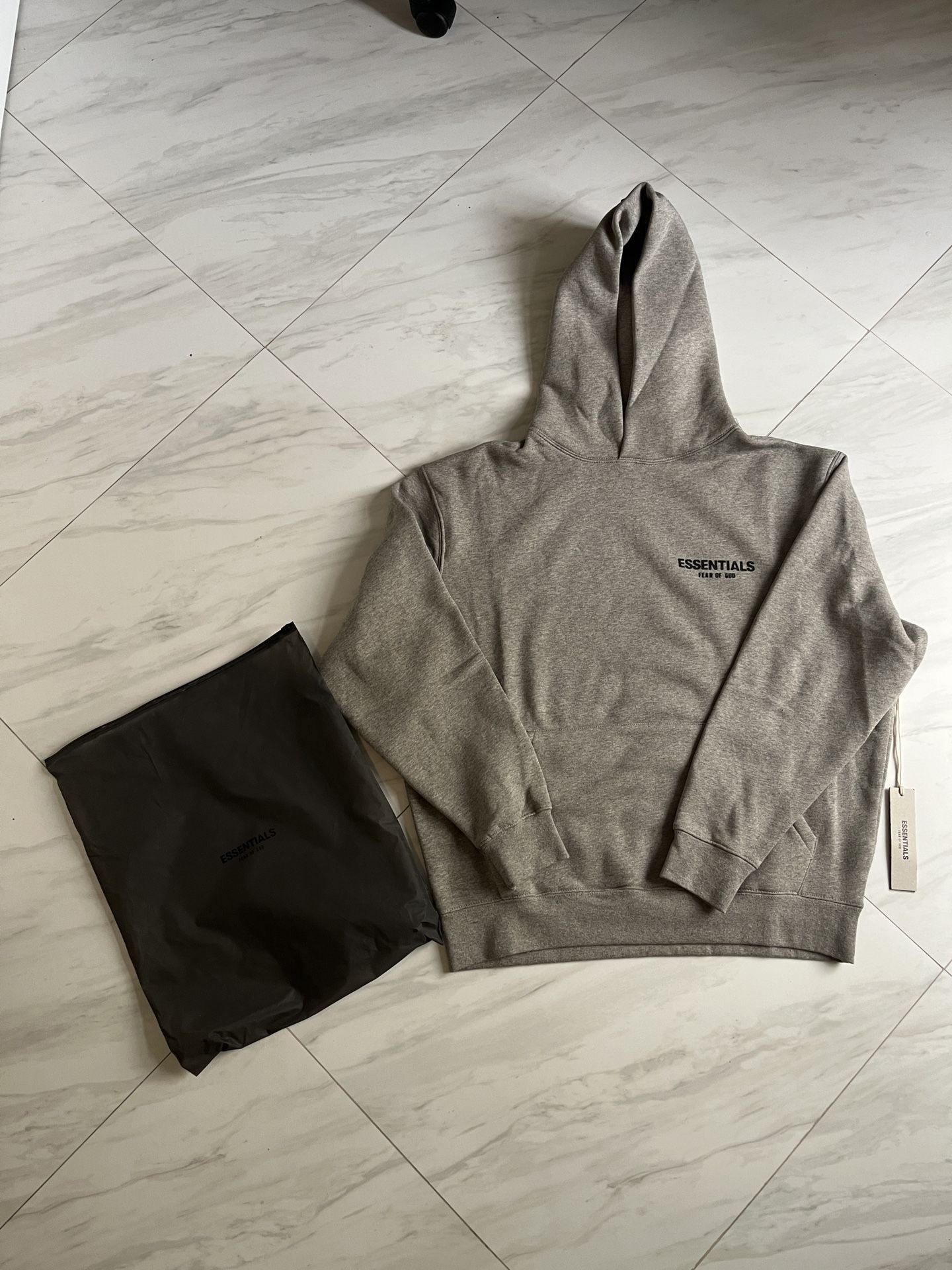 Essential fear of god hoodie size medium 