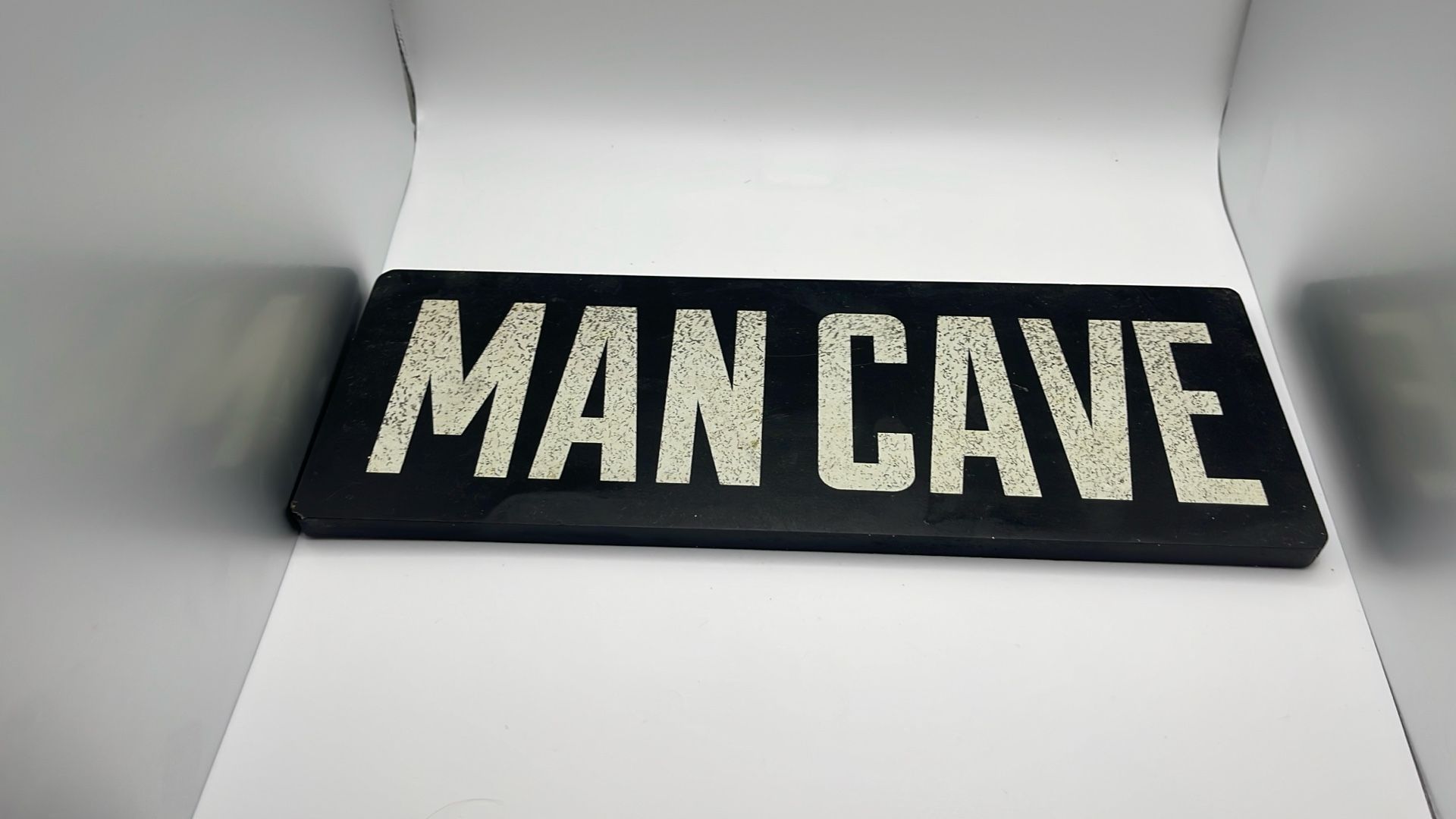 Mane Cave Sign