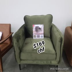 Dark green velvet fabric accent chair with metal legs