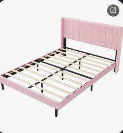 light pink bed frame with diamond in the back