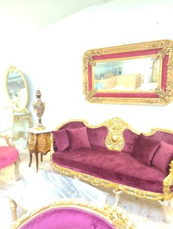  Baroque Style Mirror LOOK UP Ornate Baroque-style wall mirror with gilded frame and red velvet surround. TIME PERIOD 19th Century ORIGIN Europe ESTIM