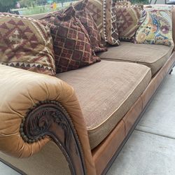 Leather couch hot sale with fabric cushions