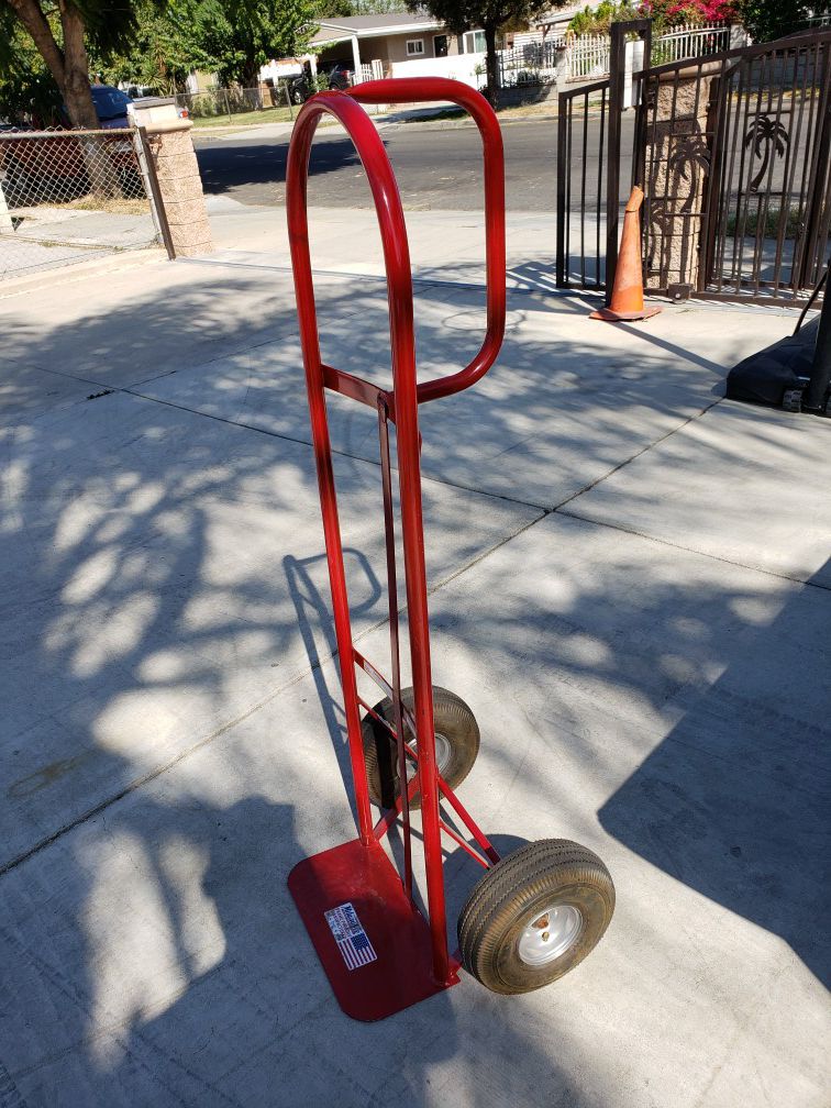 MILWAUKEE RED DOLLY WITH INFLATED RUBBER TIRES IN GREAT CONDITION LIKE NEW