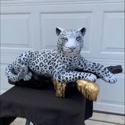 Snow Leopard On The Log Statue
