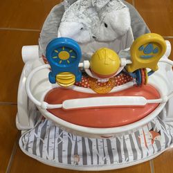 This is a Fisher-Price Sit-Me-Up floor seat. 