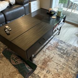 Coffee table with popup surface