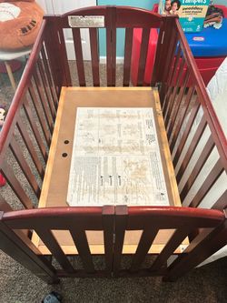 Vintage portable crib. Cherry wood