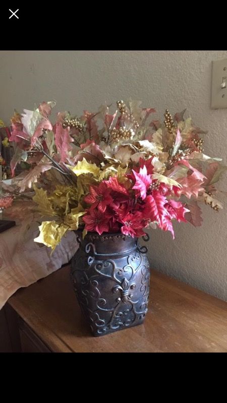 Flower vase and lot of fall leaves