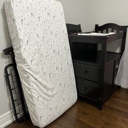 Baby Crib with changing table and mattress.