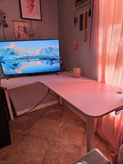 Pink L-shaped gaming desk