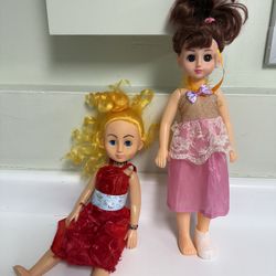 Two plastic fashion dolls and Barbie Doll accessories. 