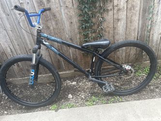 One 29 Inch On Fixie Crank And One 26 Inch On Disc Brakes And Shocks