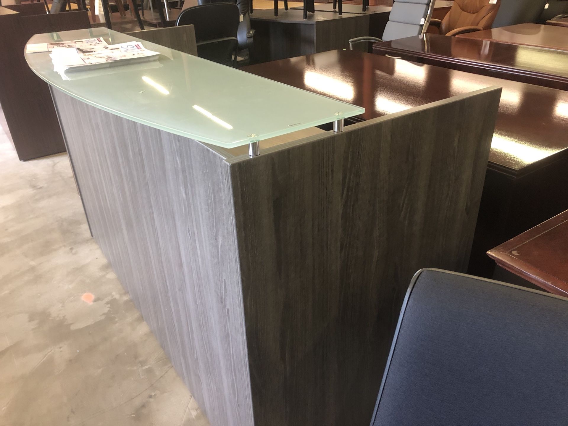New gray reception desk with glass counter