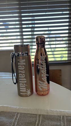 Beautiful metallic gold and rose gold stainless steel water bottle bottles. Both for $20.