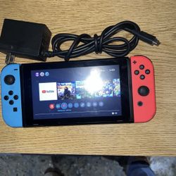 Original Nintendo Switch ( Neon Red & Blue Joycons)