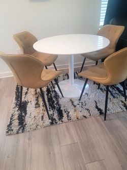 Tulip table, chairs, rug