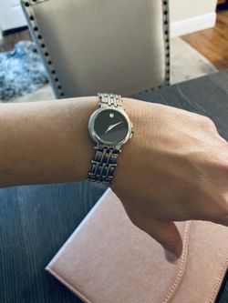 Movado Black Faced Watch W silver Band