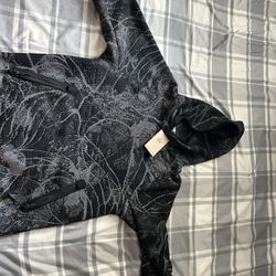 Black and grey Nike tech pack (Therma-Fit)