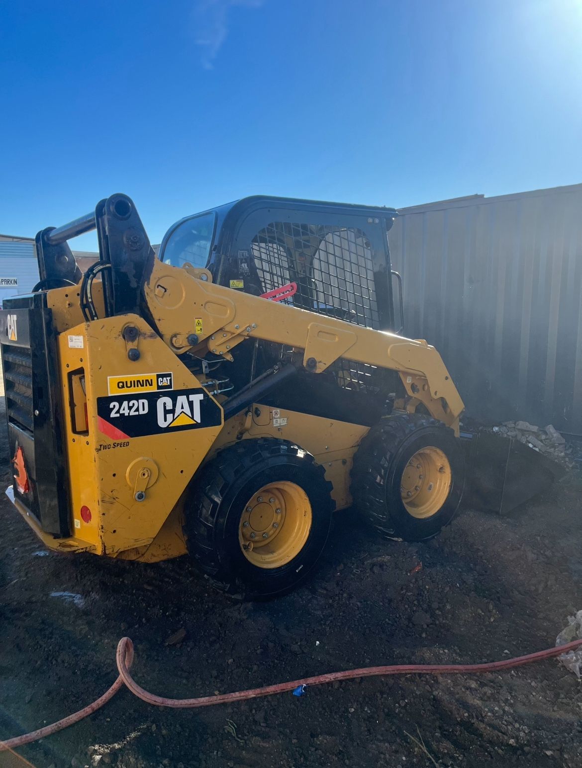 CAT Skid Steer With Bucket Attachment