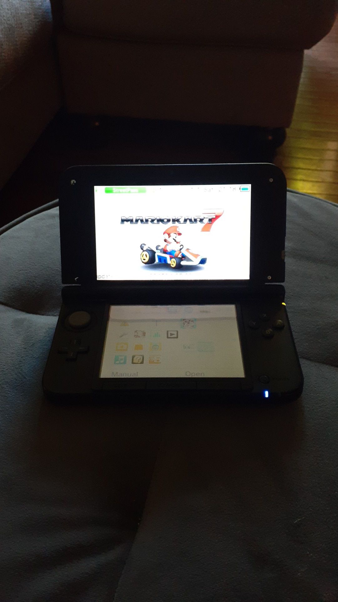 Nintendo 3ds Xl with charger and mario kart 7