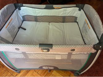 Graco Pack N Play portable playpen with bassinet