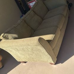 OLIVE GREEN PULL OUT COUCH