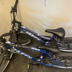 Two Huffey BIKES, One Men Blue 5’6-6’8, One Purple Kids 4’9-5’6