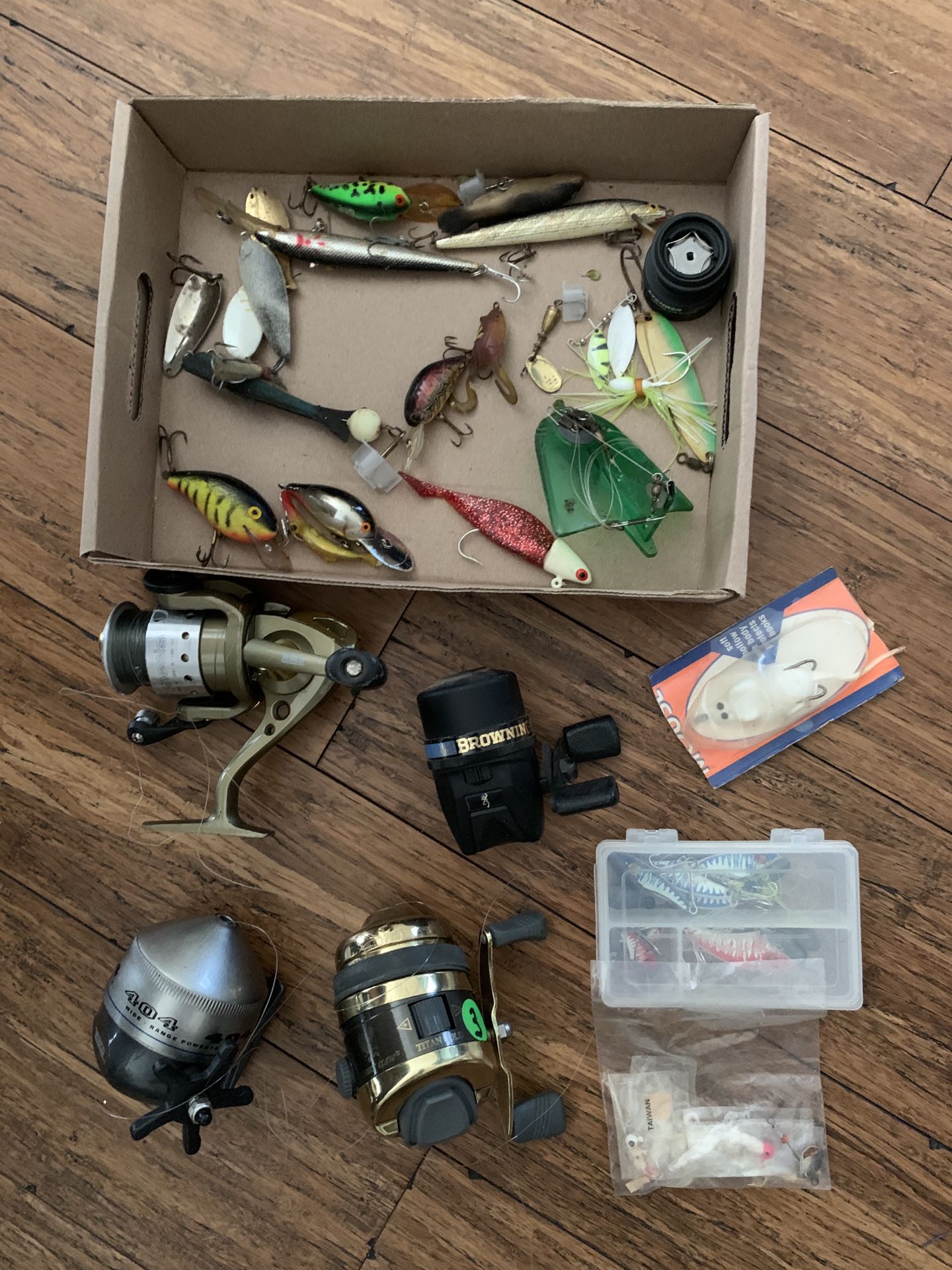 Fishing lures and reels two dollars each Reels need TLC or are for parts