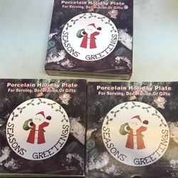 Three porcelain holiday plates snowman light three porcelain bells and three other decorations