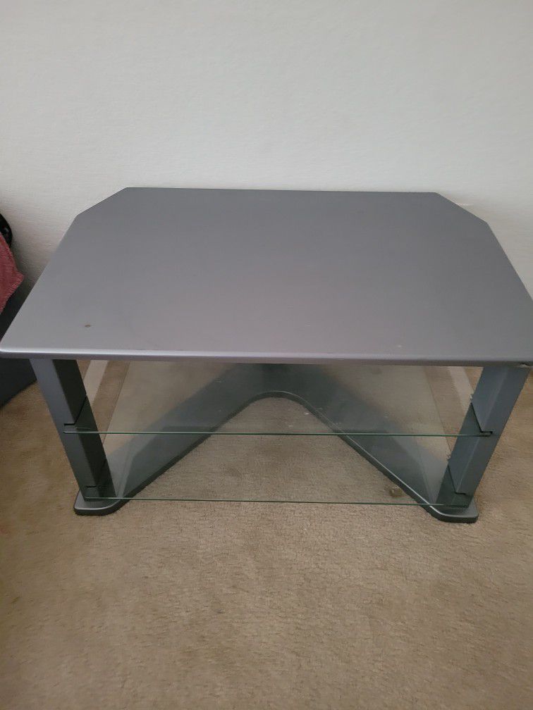 For sale $50 tv stand with nice glass shelves 