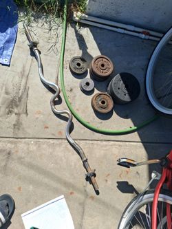 Curl bar with (52 pounds in weights)