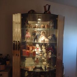 Beautiful Glass Display Case/ Hutch Filled With A Collection Of Porcelain Dolls And Glass Knickknacks 