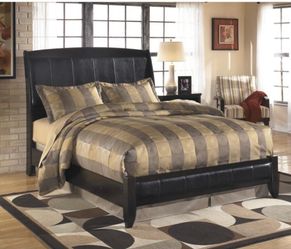 Queen faux leather upholstered wood sleigh bed