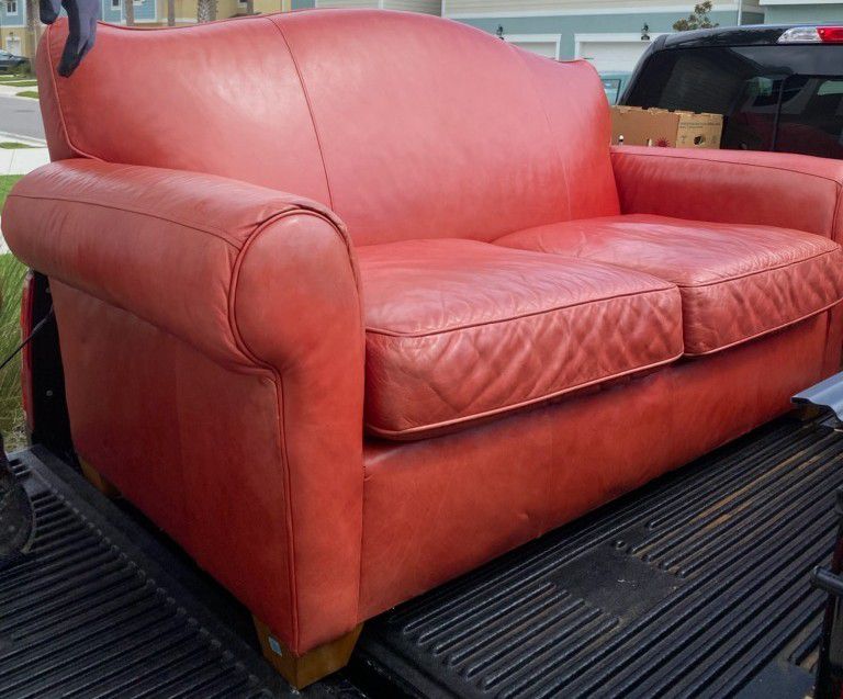 Orange leather sofa, chair , ottoman
