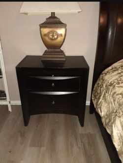 Two black large used end tables