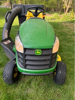 John Deere E100 with bagger attachment and mulch attachment. 88 hrs