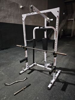 Body-Solid Power Rack with Lat Pulldown

Versatile Body-Solid power rack is white and black steel.

 It has a lat pulldown attachment, pull-up bar, di