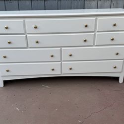 Solid wood long white dresser in good condition all drawers open just fine