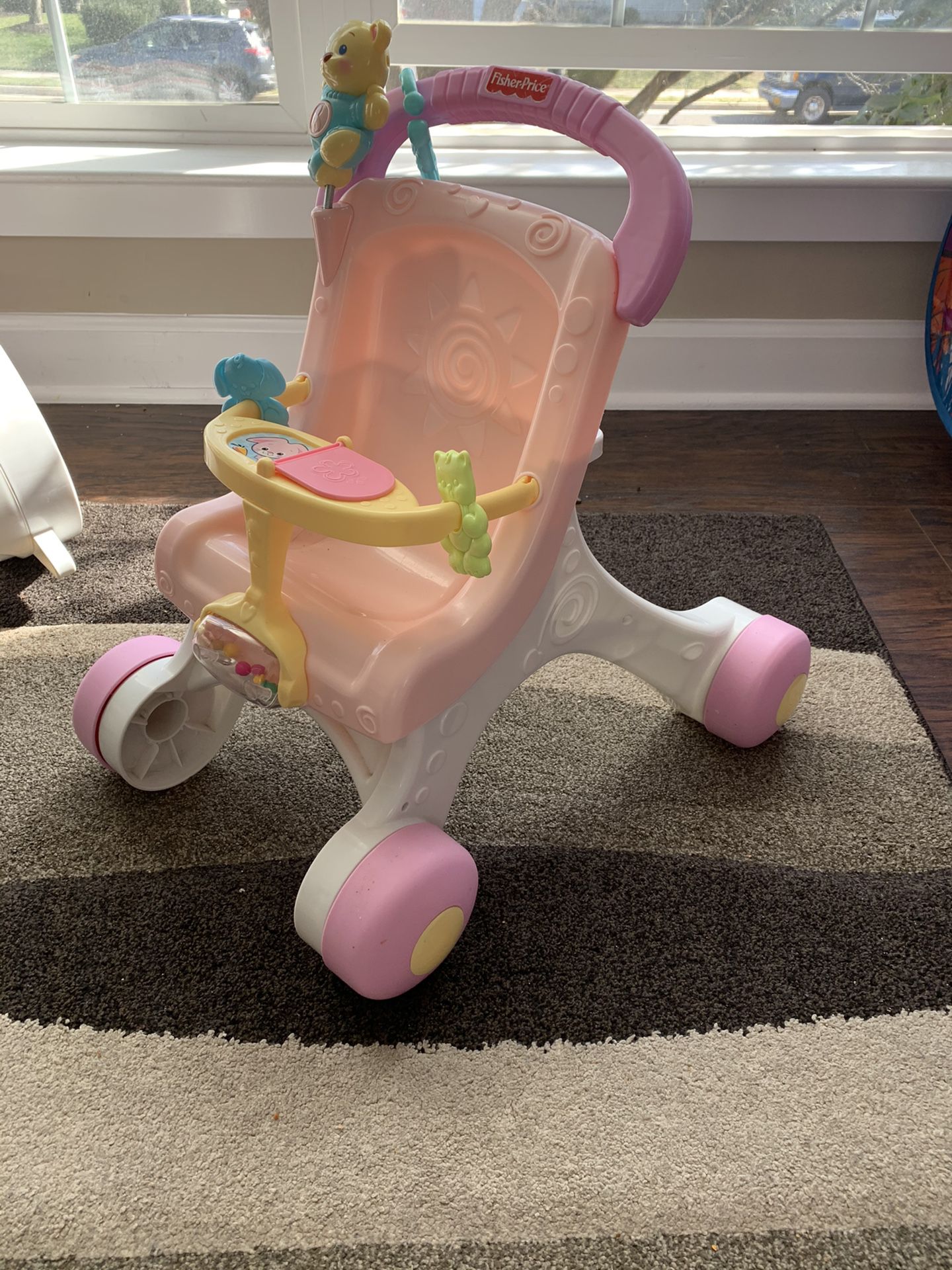 Fisher price baby walker and doll stroller.