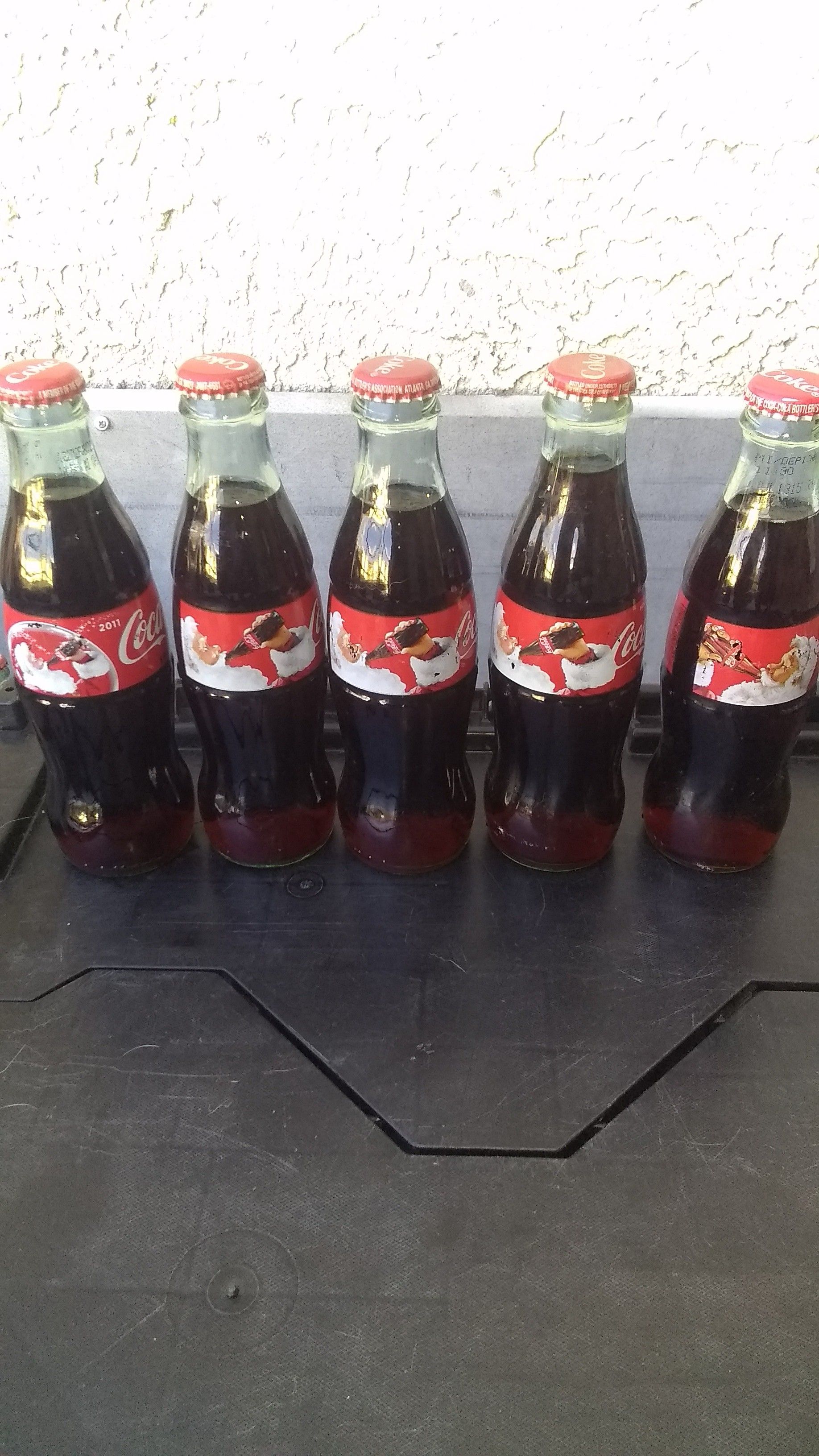 Coca-Cola holiday season bottles and then with rare reverse image on the bottle.