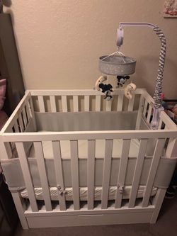 White mini crib