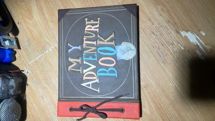 Disney Pixar Up Adventure Book Replica https://offerup.com/redirect/?o=Sm91cm5hbC5JdA== is a hardcover scrapbook inspired by the one Ellie gives Carl 