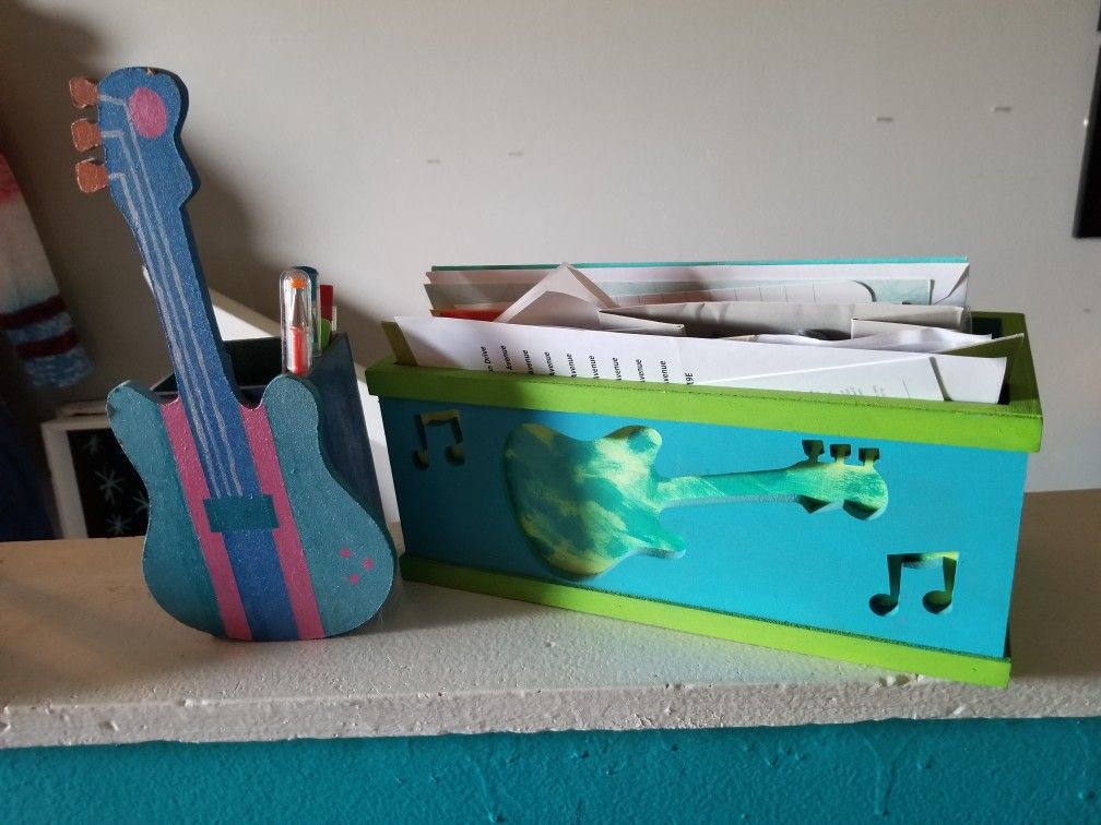 Guitar pencil and letter holder